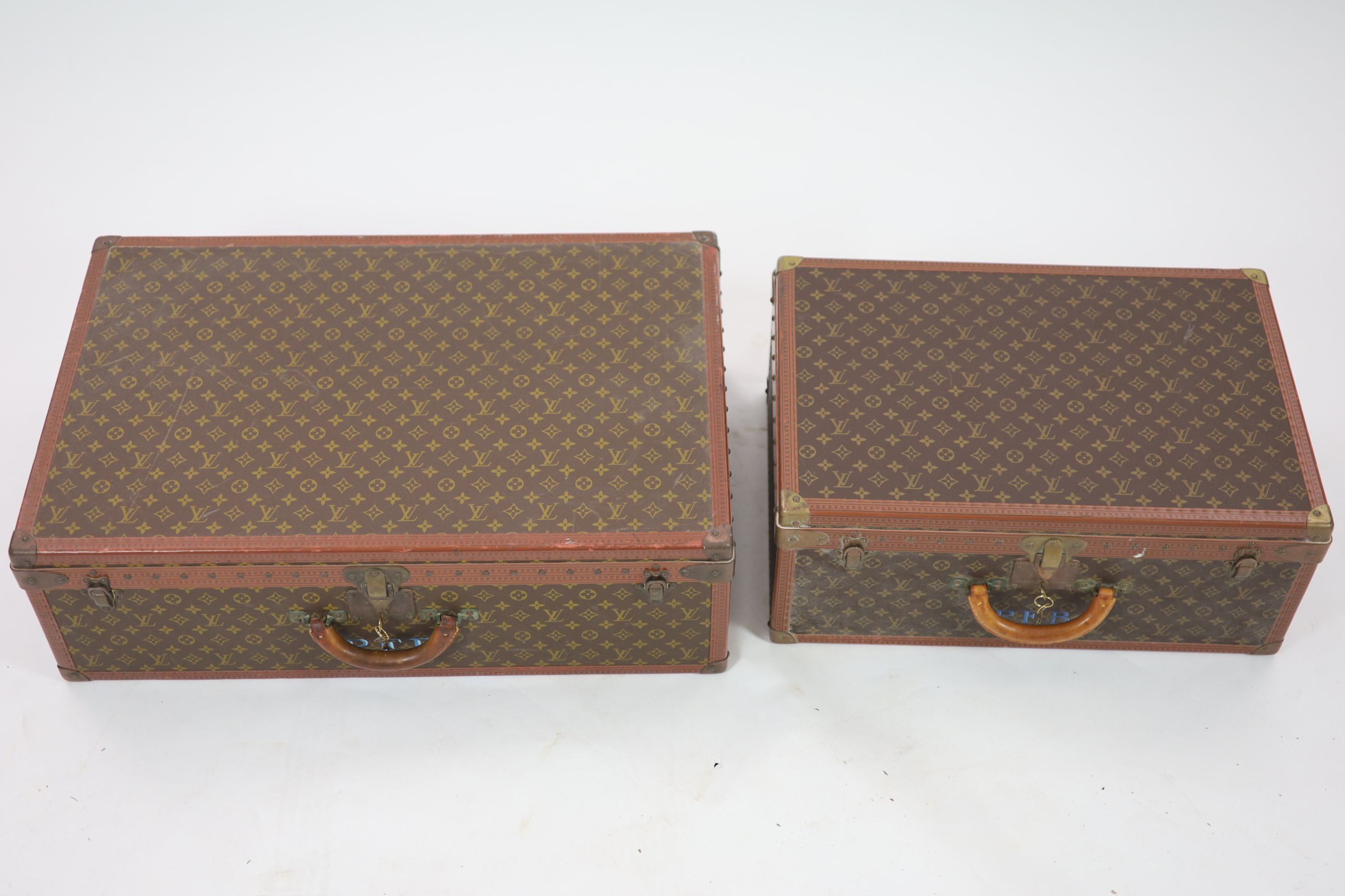 Two graduated Louis Vuitton Alzer suitcase trunks